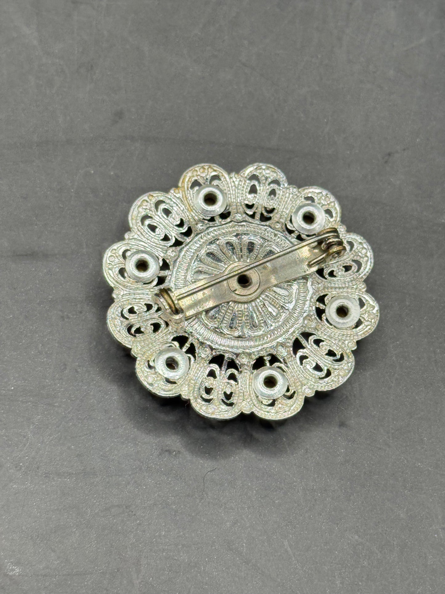Vintage Silver-Tone Filigree Brooch with Red Stones
