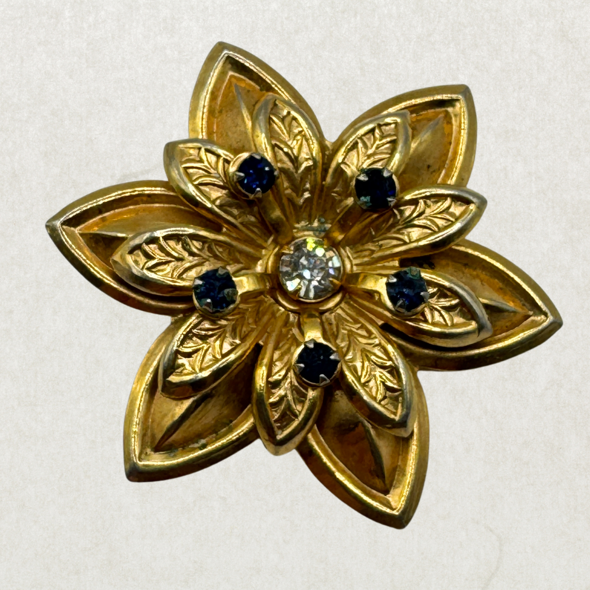 Vintage Gold Tone Floral Brooch Pendant with Blue Rhinestones – 1960s Statement Flower Pin